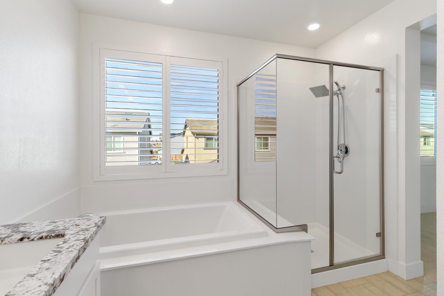 4263 Orpheus Circle Rancho Cordova, CA 95742 - Photo 38 of 51 a bathroom with a bathtub and a shower