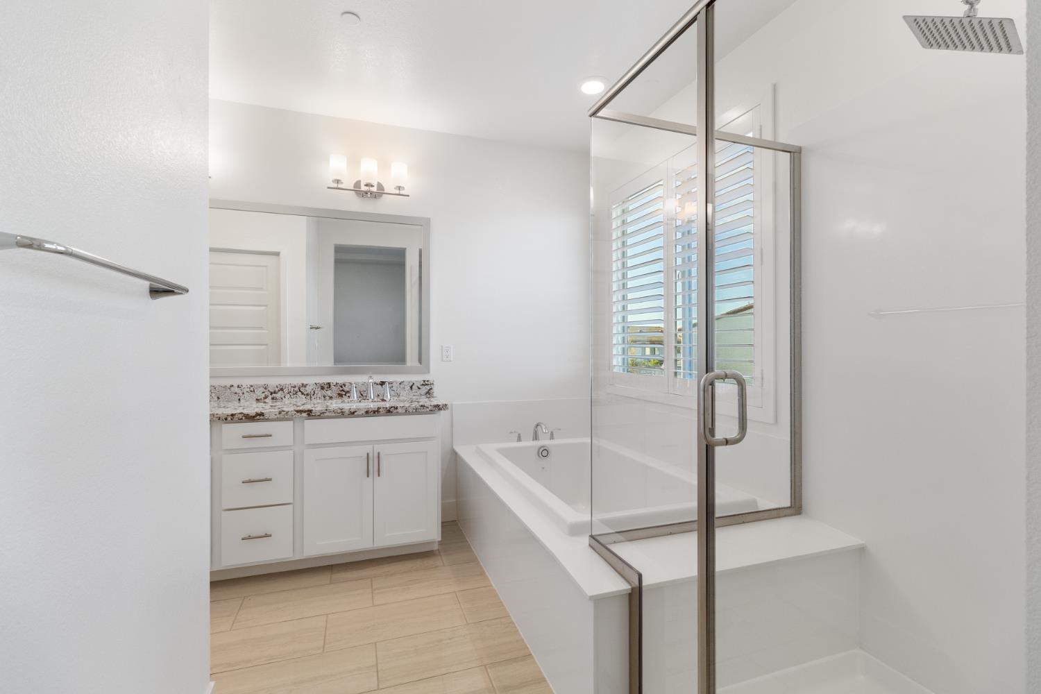 4263 Orpheus Circle Rancho Cordova, CA 95742 - Photo 39 of 51 a bathroom with a tub sink shower and mirror