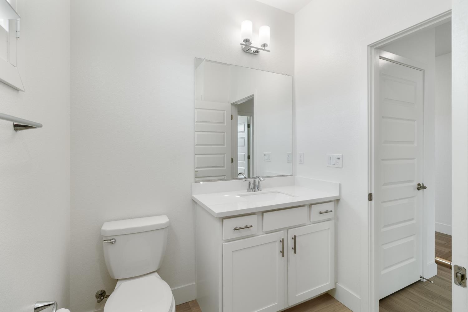 4263 Orpheus Circle Rancho Cordova, CA 95742 - Photo 46 of 51 a bathroom with a toilet sink and mirror