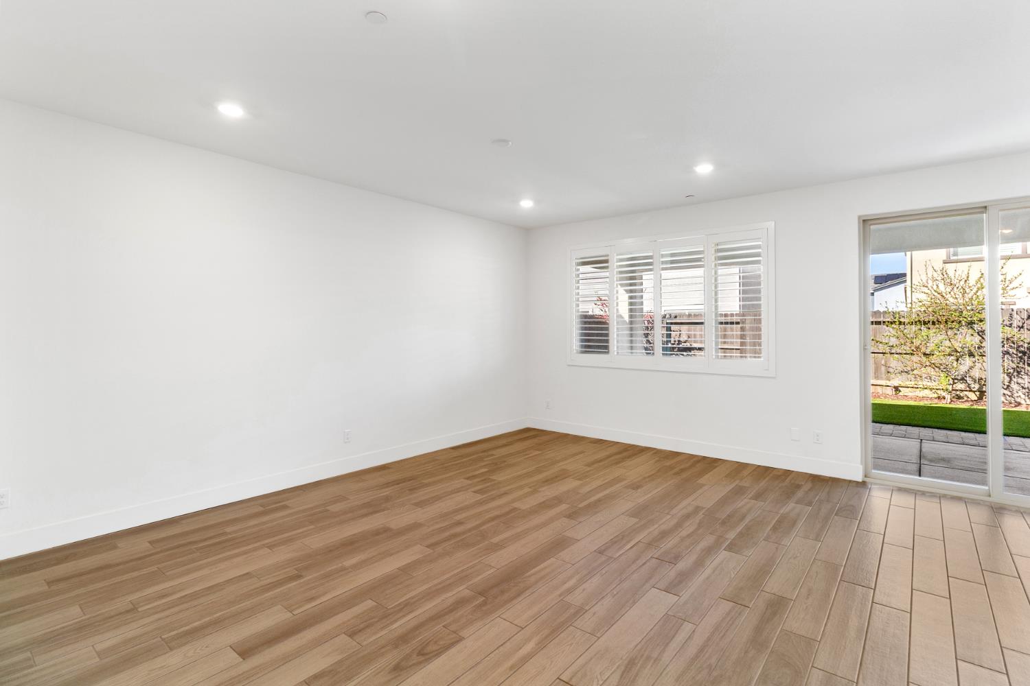 4263 Orpheus Circle Rancho Cordova, CA 95742 - Photo 5 of 51 an empty room with wooden floor and windows