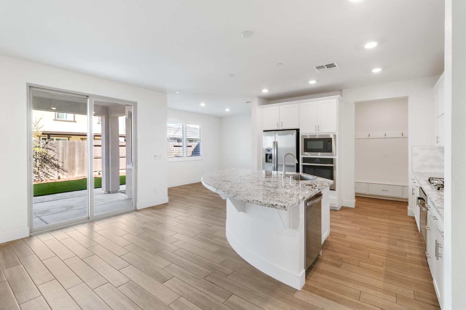 4263 Orpheus Circle Rancho Cordova, CA 95742 - Photo 10 of 51 a large kitchen with stainless steel appliances granite countertop a large counter top and a wooden floors