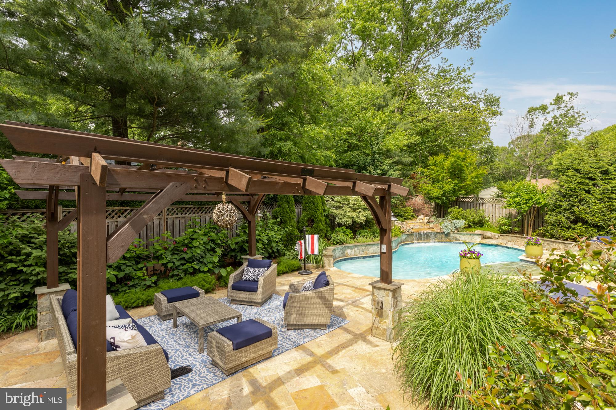 a view of a patio with table and chairs and potted plants