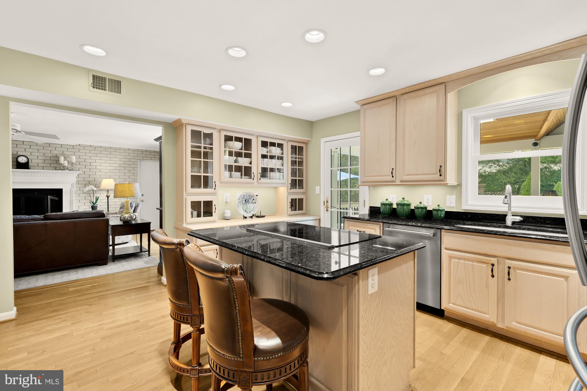 5117 Pheasant Ridge Road Fairfax, VA 22030 - Photo 12 of 59 a kitchen with stainless steel appliances granite countertop a stove a sink and a refrigerator