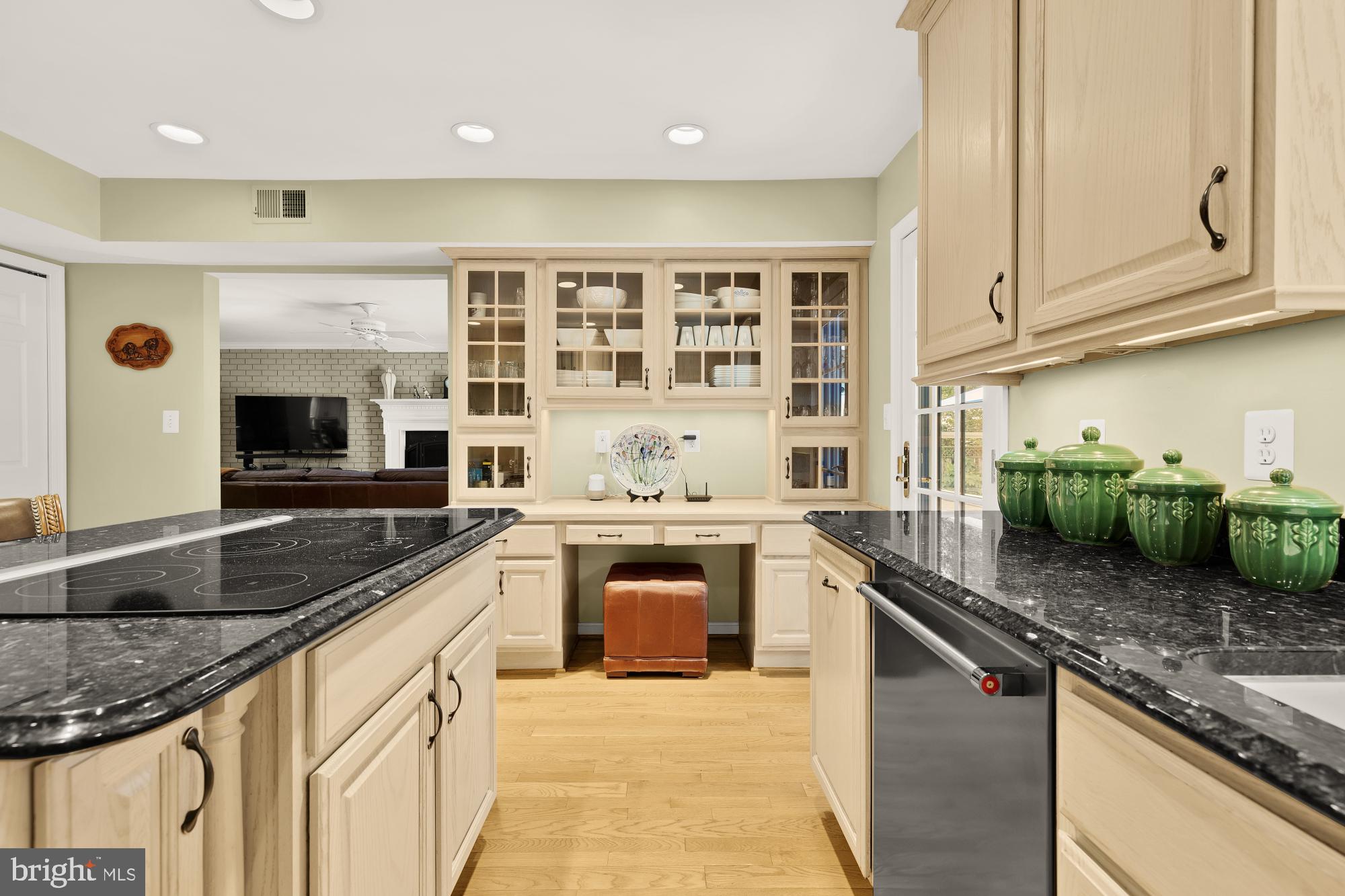 5117 Pheasant Ridge Road Fairfax, VA 22030 - Photo 15 of 59 a kitchen with stainless steel appliances granite countertop a stove sink and cabinets