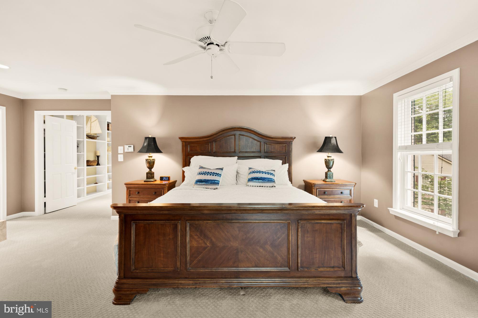 5117 Pheasant Ridge Road Fairfax, VA 22030 - Photo 29 of 59 a bedroom with a bed and a large window