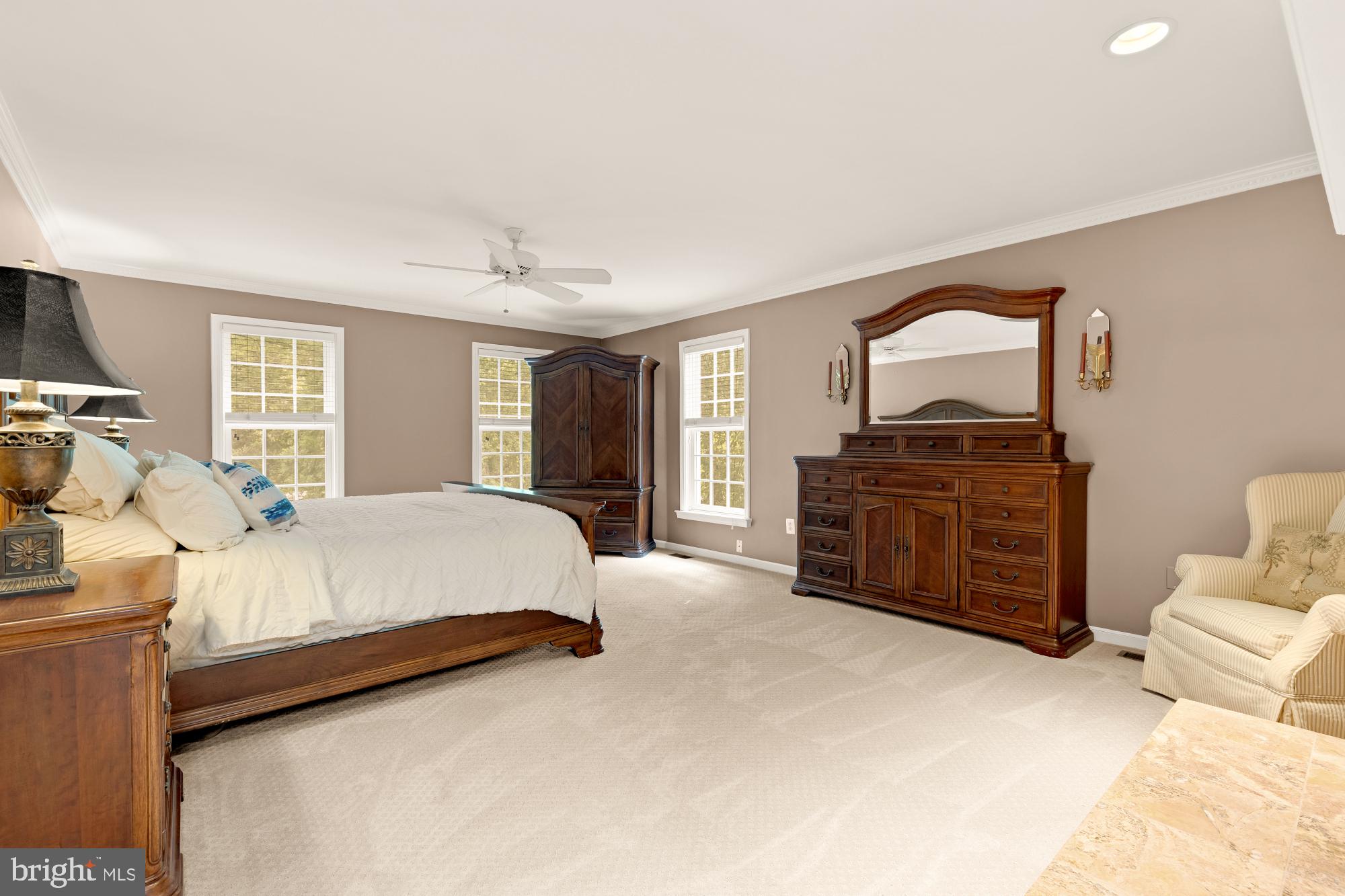 5117 Pheasant Ridge Road Fairfax, VA 22030 - Photo 30 of 59 a bed room with a bed and dresser