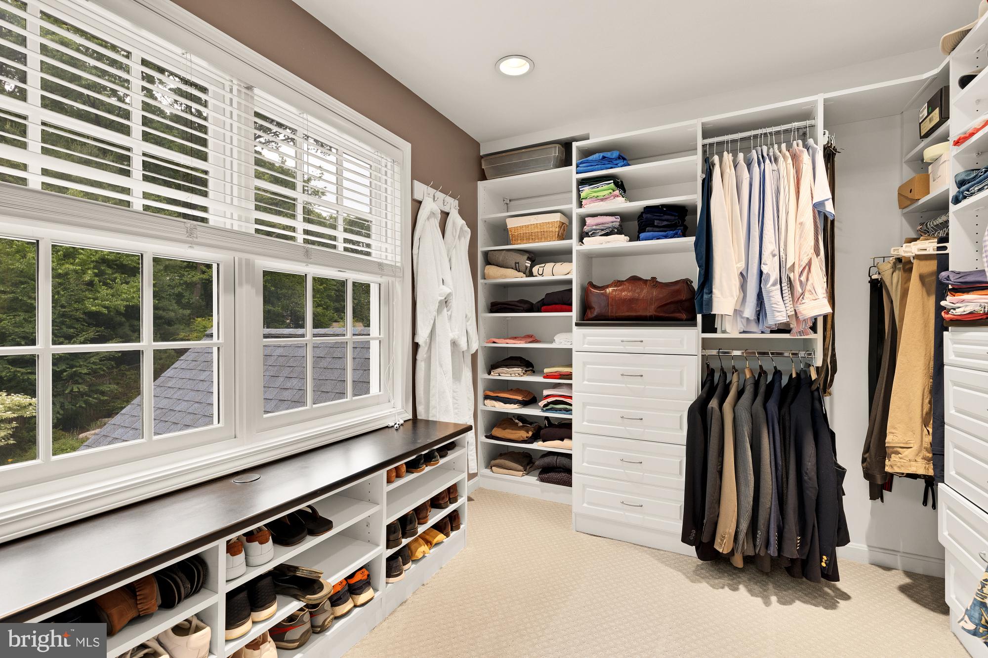 5117 Pheasant Ridge Road Fairfax, VA 22030 - Photo 37 of 59 a view of walk in closet with clothes and shoes