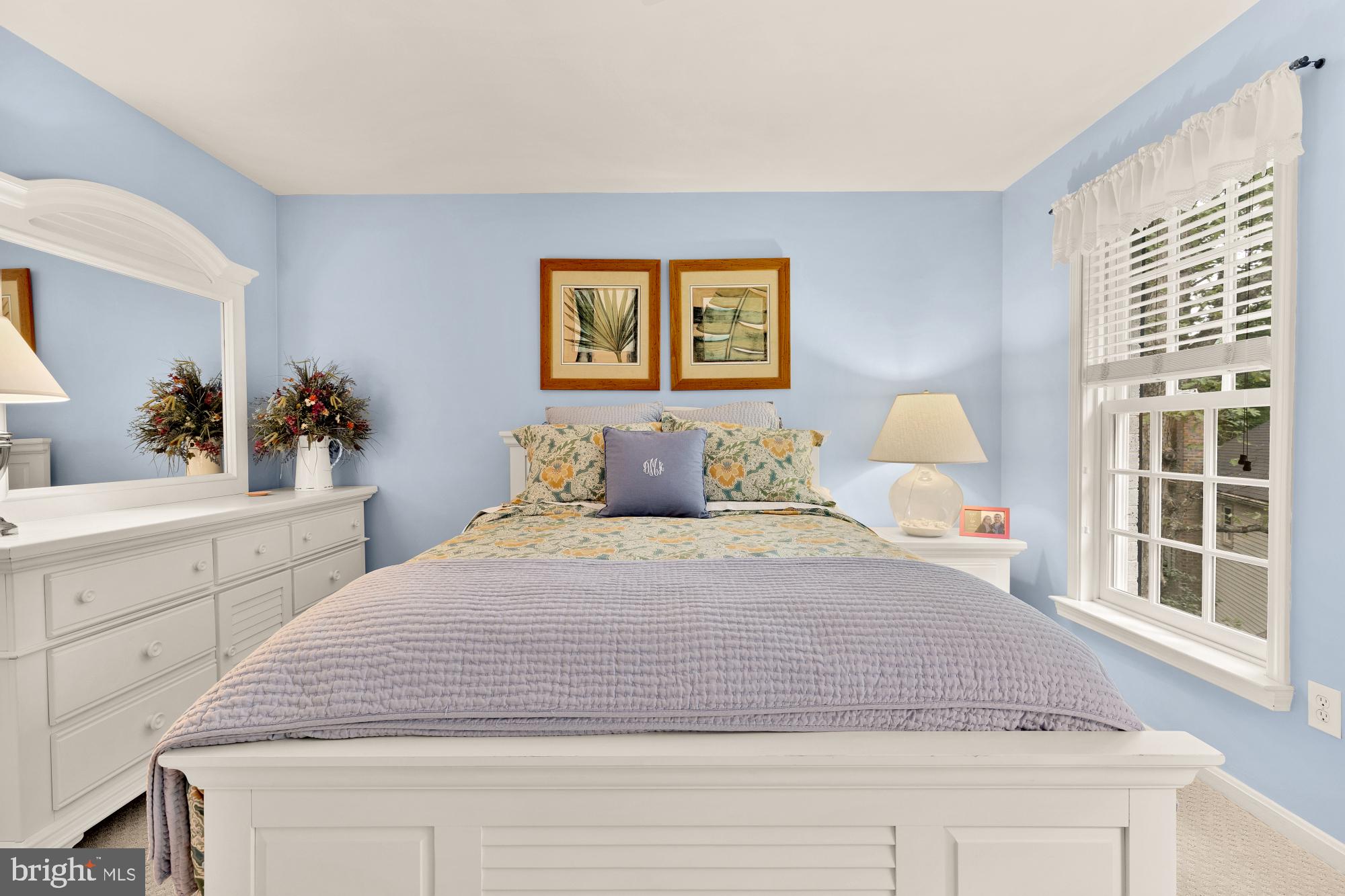 5117 Pheasant Ridge Road Fairfax, VA 22030 - Photo 45 of 59 a bedroom with a large bed and a large window