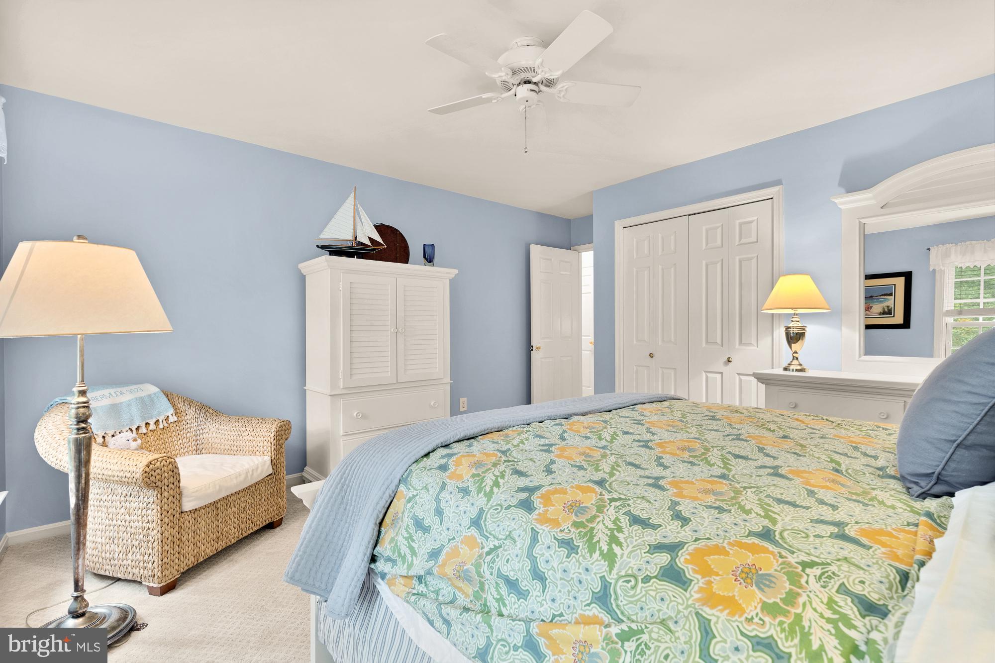 5117 Pheasant Ridge Road Fairfax, VA 22030 - Photo 46 of 59 a bedroom with a bed and a lamp