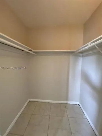 a view of an empty walk in closet
