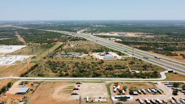 a view of a lake in middle of forest