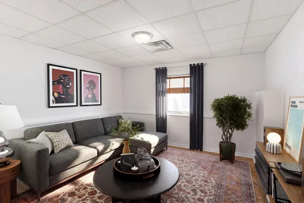 a bedroom with a large bed and a desk
