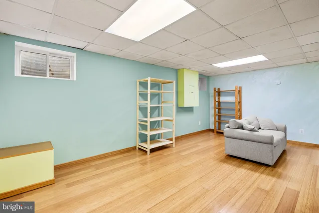 a view of a livingroom with furniture and a window