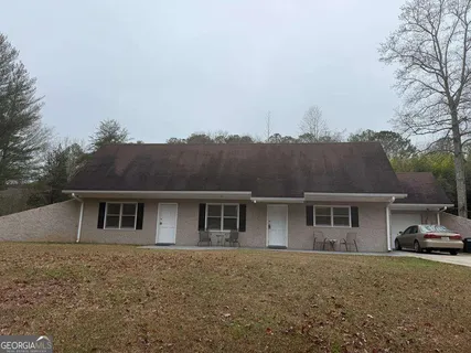 front view of a house with a yard