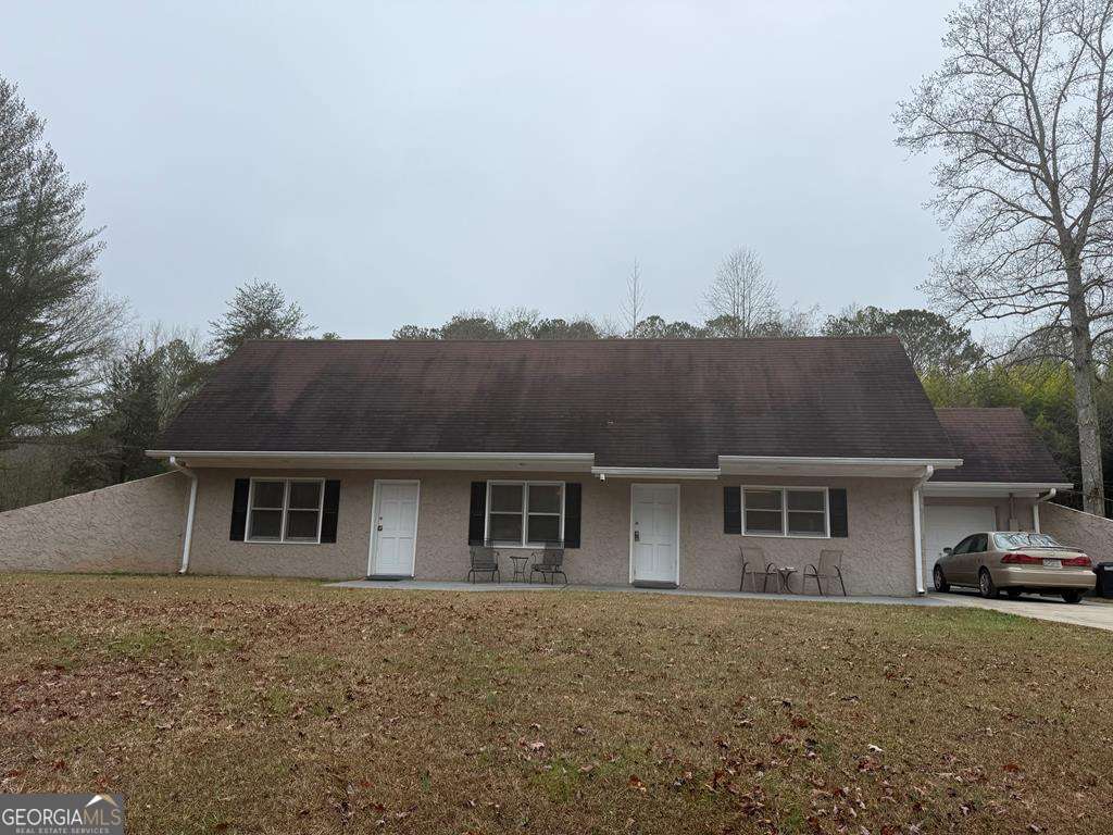 front view of a house with a yard
