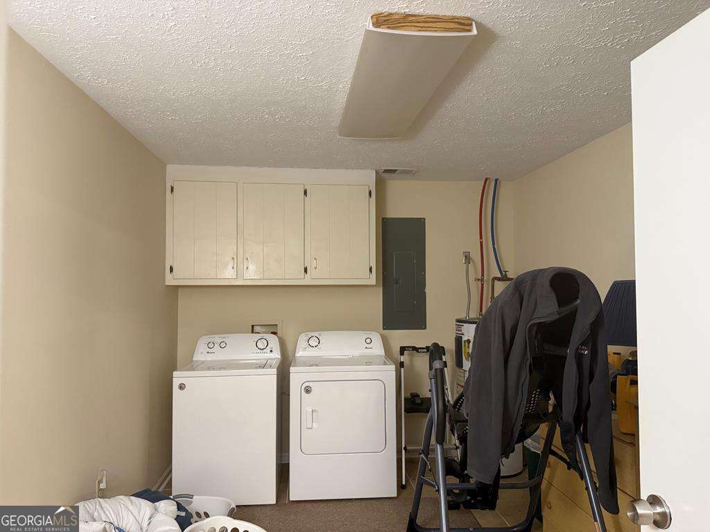 1837 Whooping Creek Road Carrollton, GA 30116 - Photo 11 of 19 a view of a storage & utility room with washer and dryer