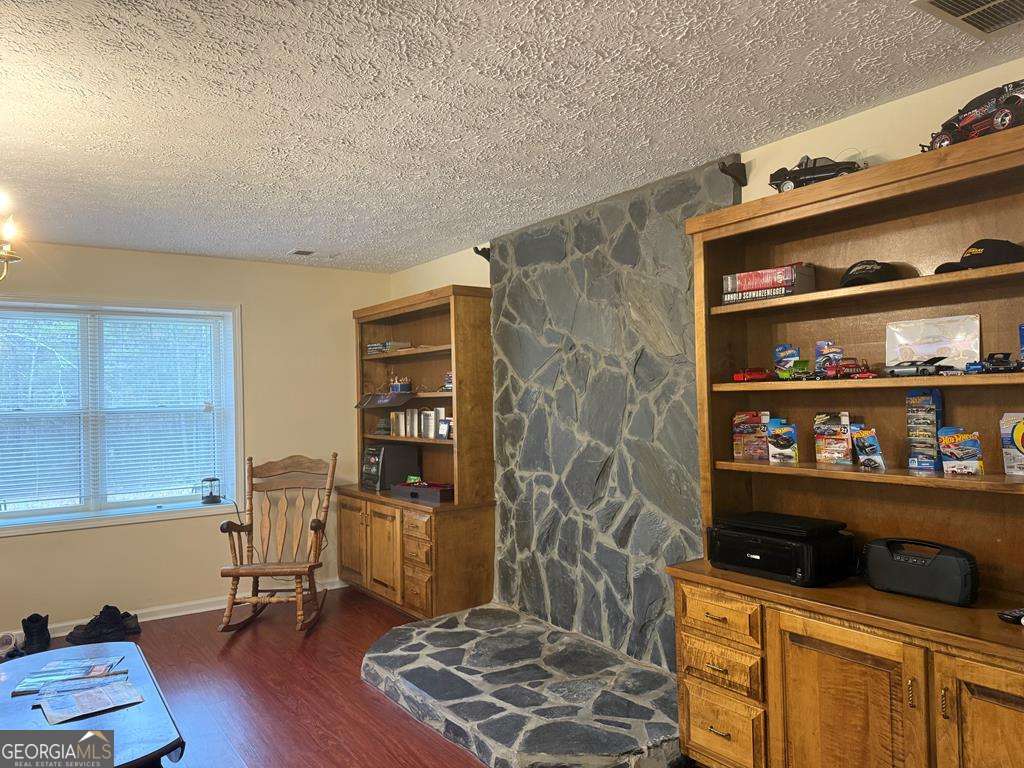 1837 Whooping Creek Road Carrollton, GA 30116 - Photo 5 of 19 a room with furniture and wooden floor