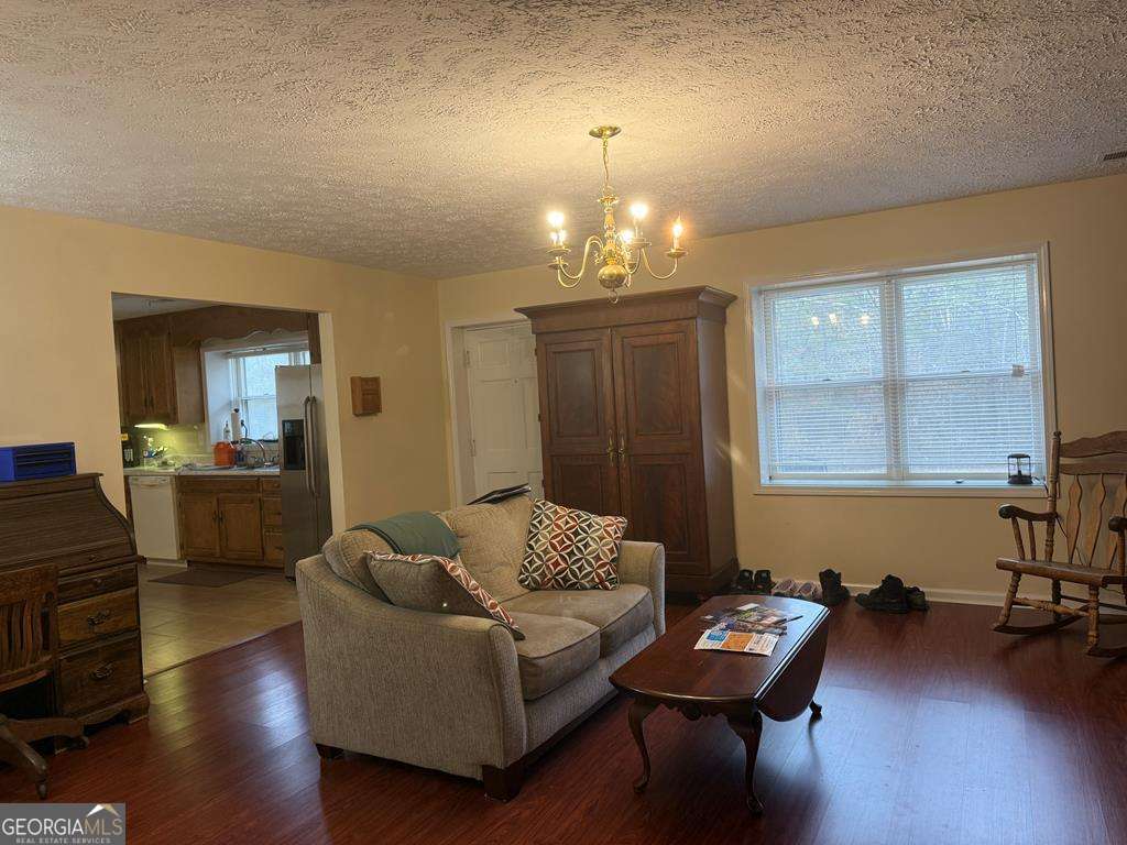 1837 Whooping Creek Road Carrollton, GA 30116 - Photo 6 of 19 a living room with furniture and wooden floor