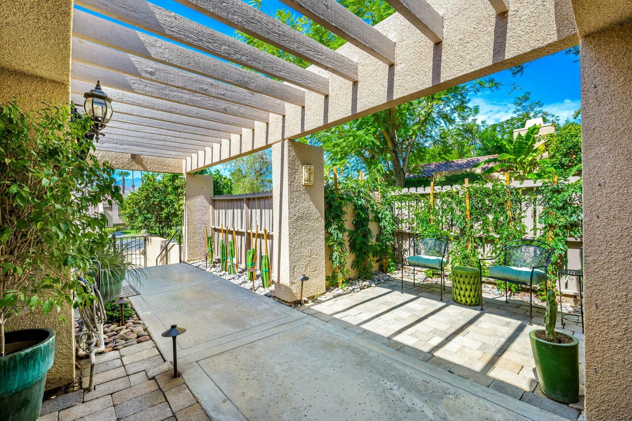 38 Mission Court Rancho Mirage, CA 92270 - Photo 21 of 61 a view of a backyard with garden