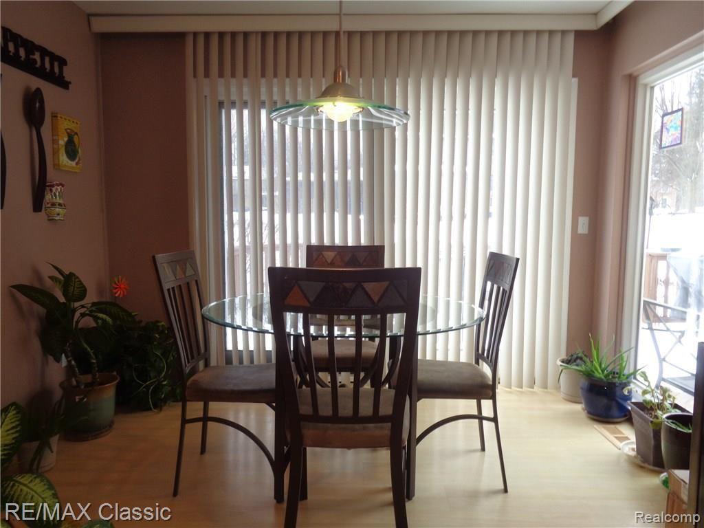 35235 Spring Hill Road Farmington, MI 48331 - Photo 12 of 28 SUNNY BREAKFAST ROOM W/2 DOORWALLS TO DECK & YARD