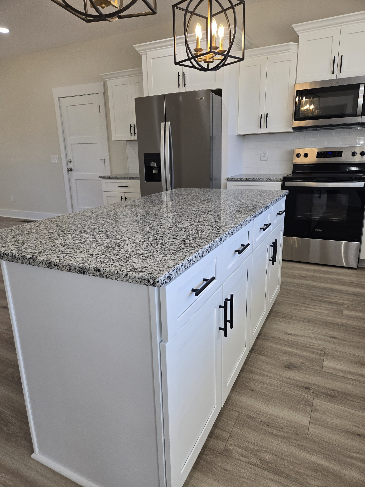 6006 Valley Road Springfield, TN 37172 - Photo 7 of 33 a kitchen with stainless steel appliances granite countertop a sink and a stove