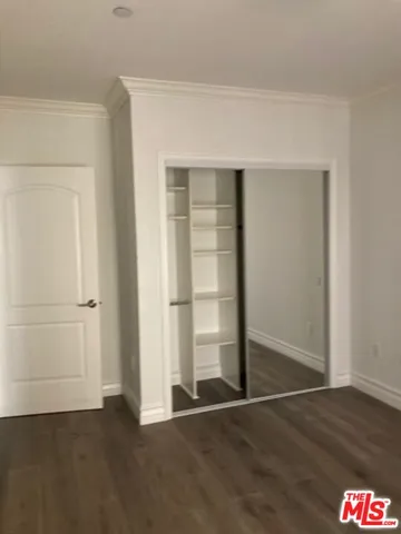 an empty room with wooden floor