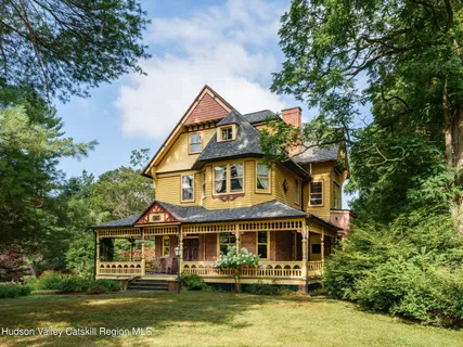 a front view of a house with a boat