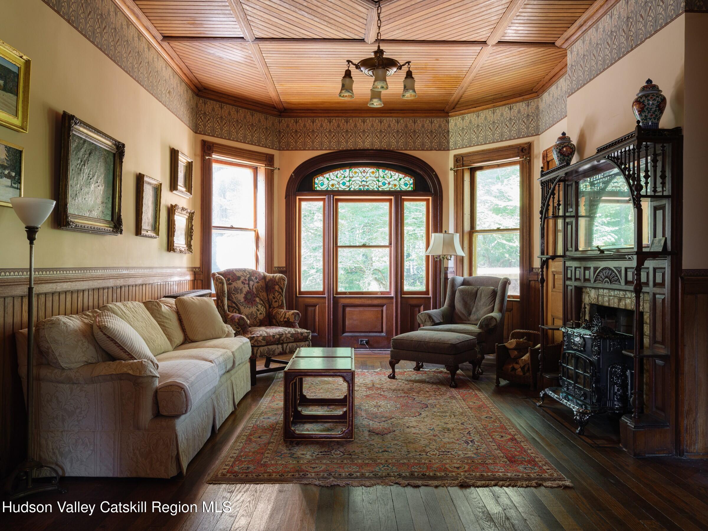 2659 County Rte 9 East Chatham, NY 12060 - Photo 12 of 46 a living room with furniture and floor to ceiling windows