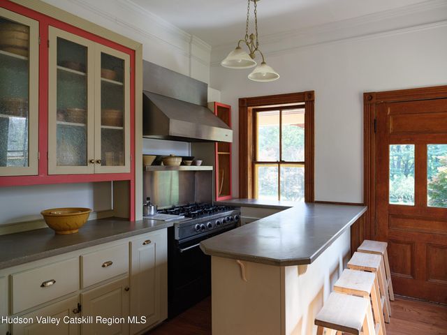 a kitchen with stainless steel appliances granite countertop a stove and a sink