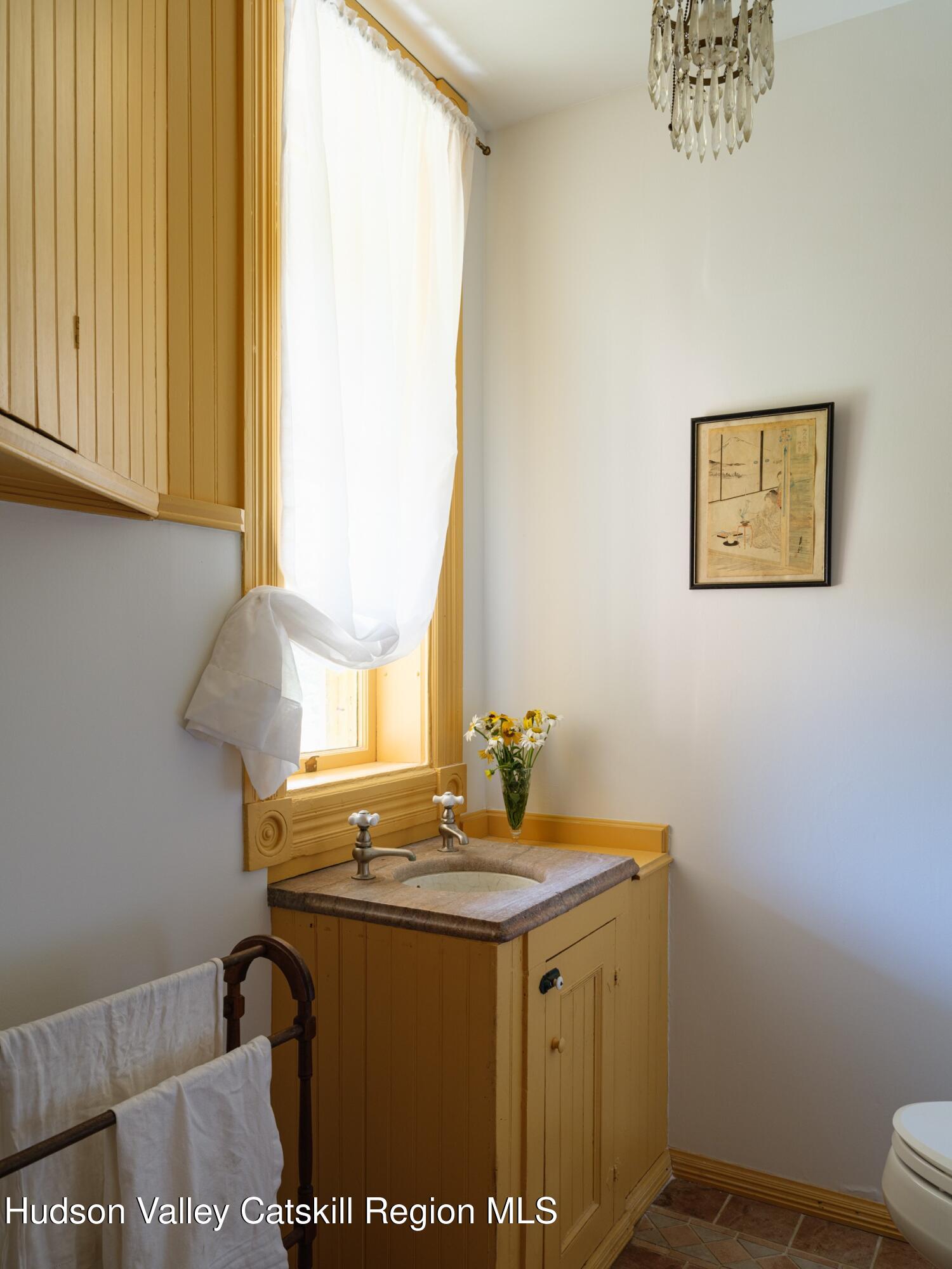 2659 County Rte 9 East Chatham, NY 12060 - Photo 16 of 46 a bathroom with a sink and a mirror