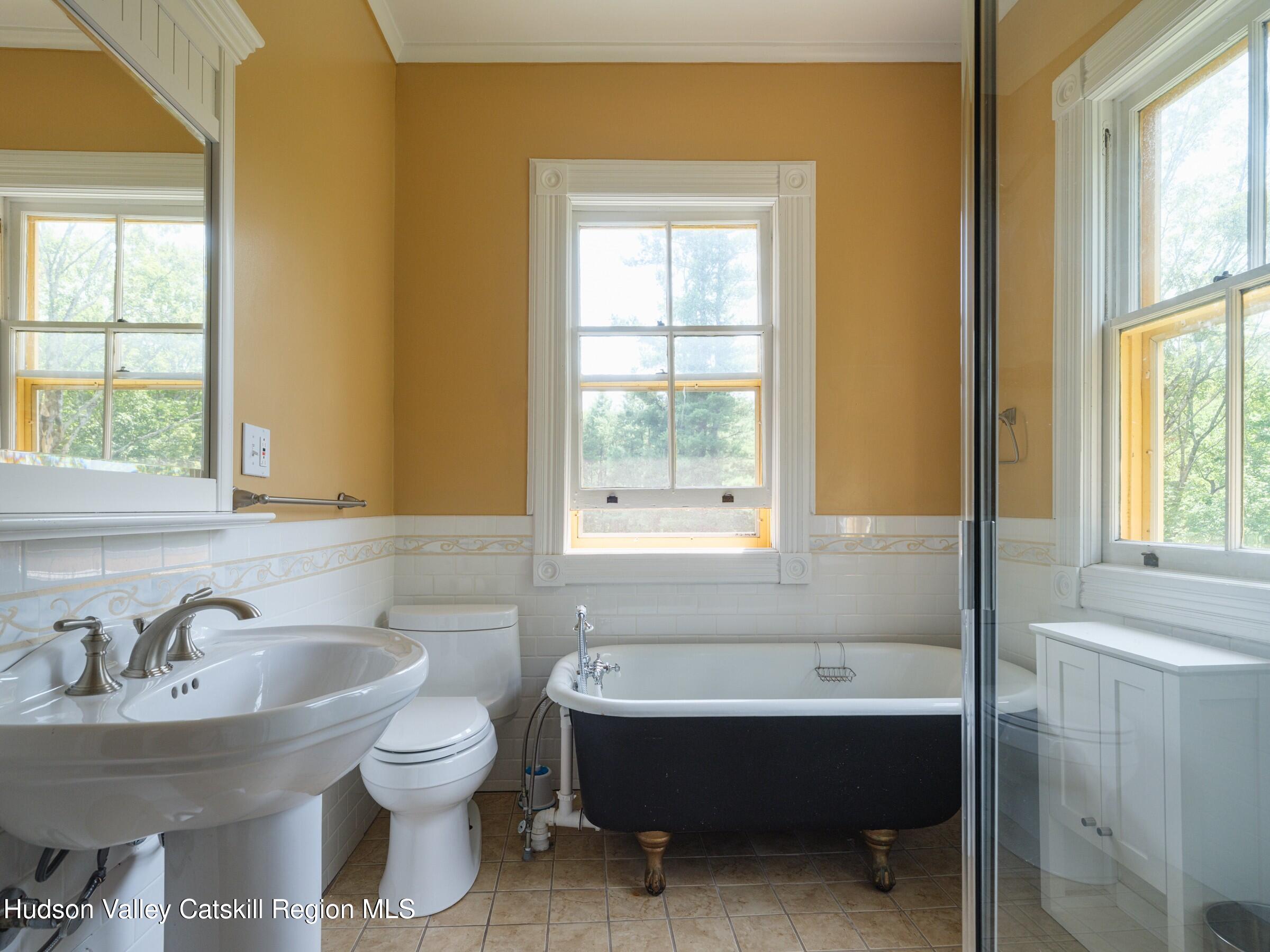 2659 County Rte 9 East Chatham, NY 12060 - Photo 24 of 46 a bathroom with a sink and a bathtub