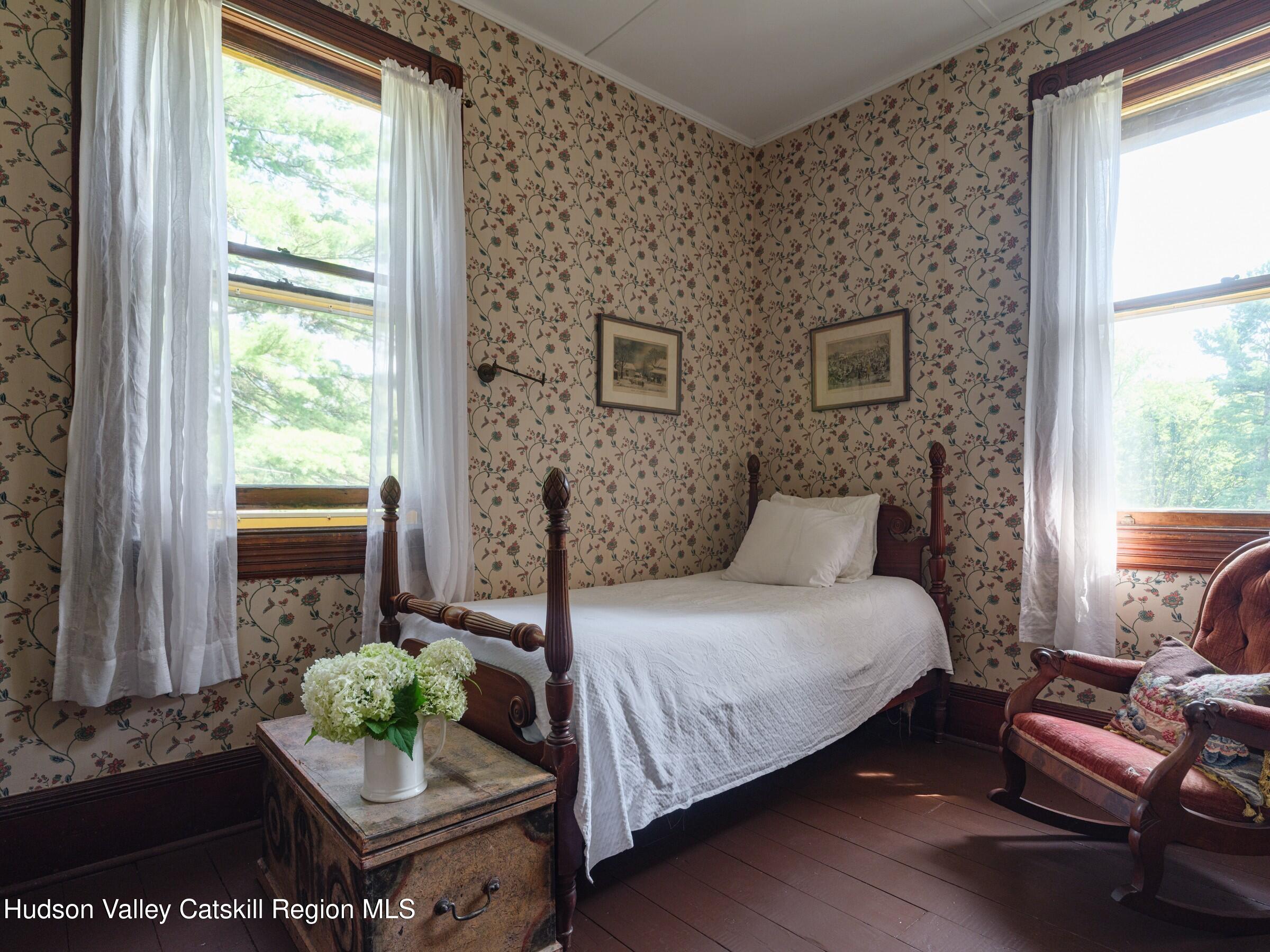 2659 County Rte 9 East Chatham, NY 12060 - Photo 26 of 46 a bedroom with a bed and windows
