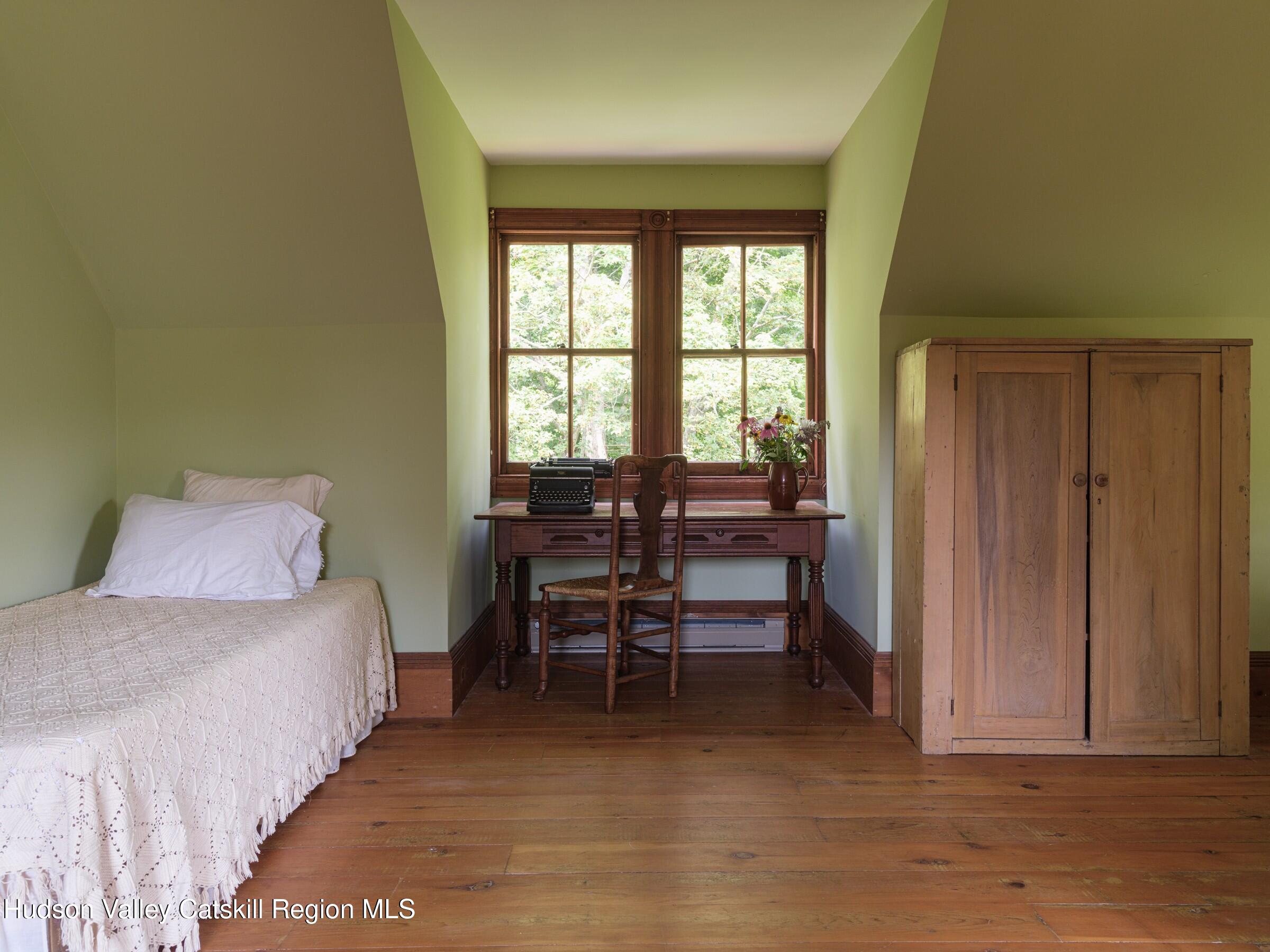 2659 County Rte 9 East Chatham, NY 12060 - Photo 30 of 46 a view of a bedroom with furniture and windows