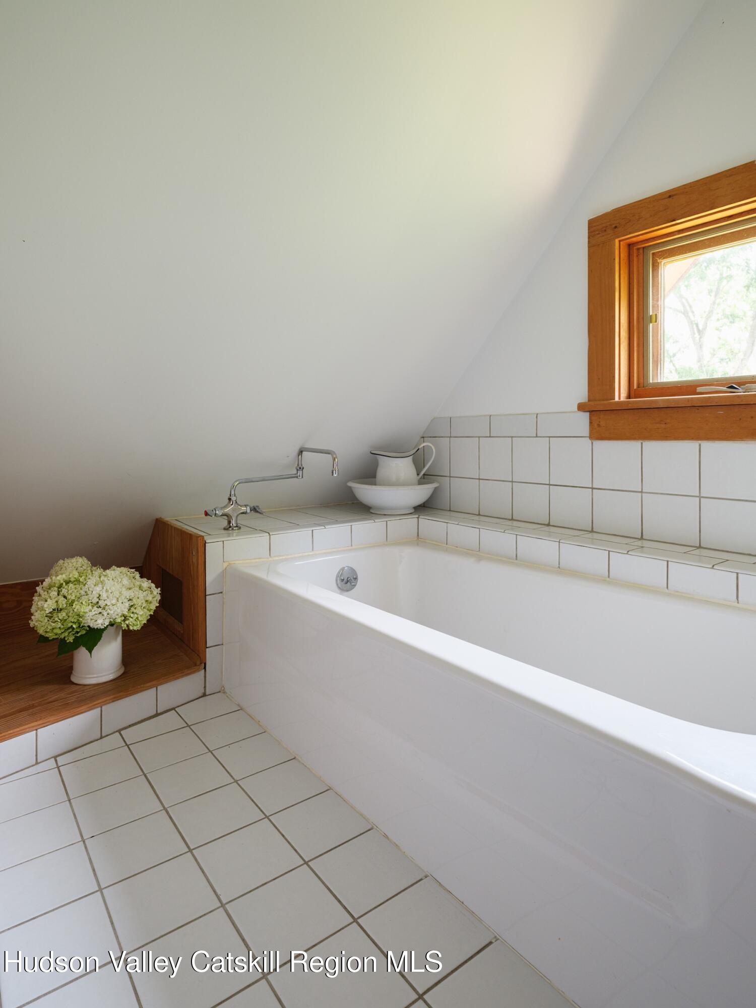 2659 County Rte 9 East Chatham, NY 12060 - Photo 33 of 46 a white bath tub sitting next to a white sink