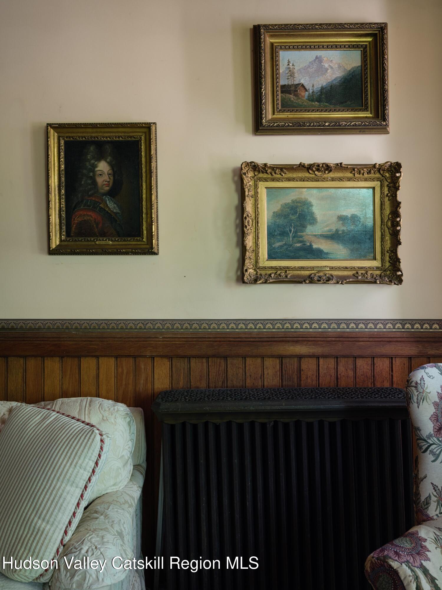 2659 County Rte 9 East Chatham, NY 12060 - Photo 35 of 46 a bedroom with a bed and paintings on the wall