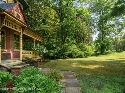a view of a chair and table of the house in the garden