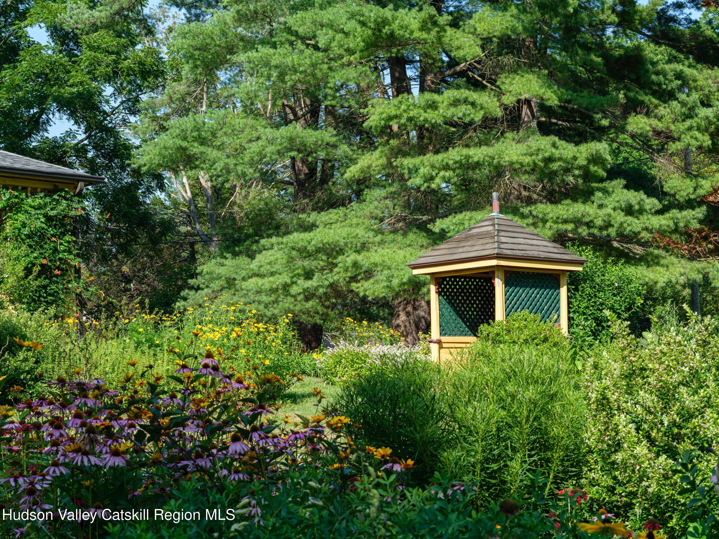 2659 County Rte 9 East Chatham, NY 12060 - Photo 42 of 46 a view of a garden with a house