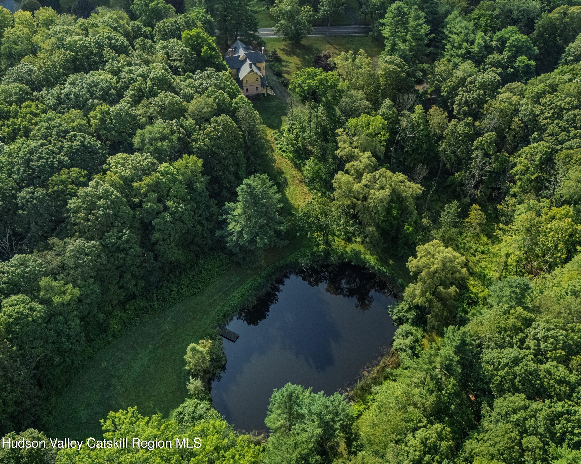 2659 County Rte 9 East Chatham, NY 12060 - Photo 44 of 46 an aerial view of a house with a yard and lake view