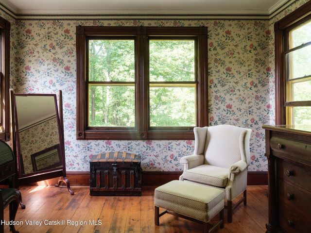 a living room with a couch and a fireplace