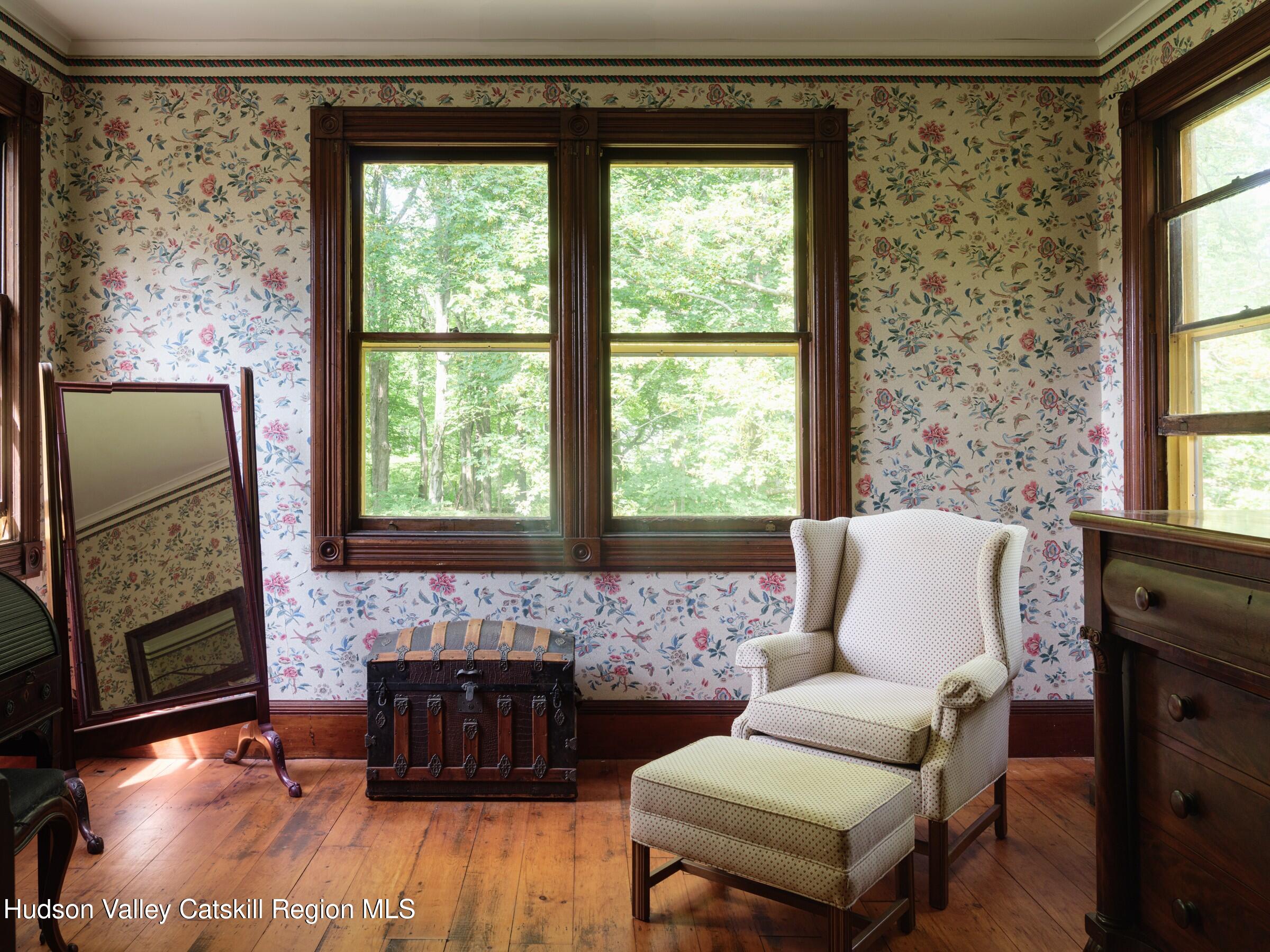 2659 County Rte 9 East Chatham, NY 12060 - Photo 6 of 46 a living room with a couch and a fireplace