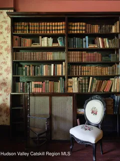 a view of a chairs and table in a room
