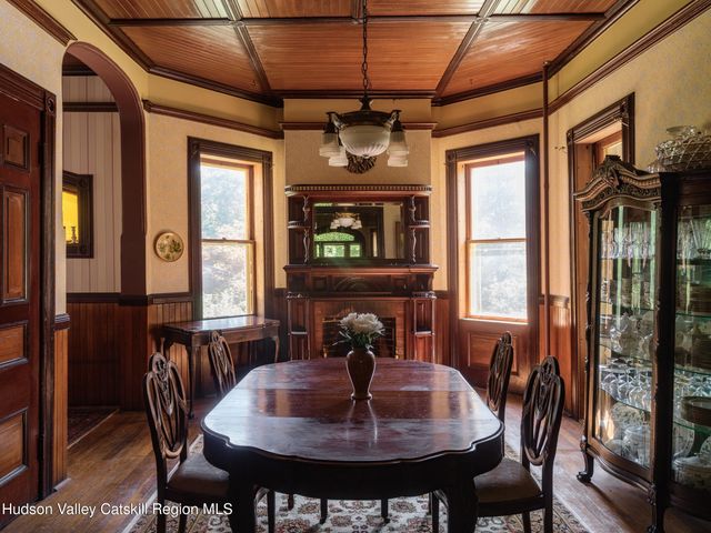 a view of a dining room with furniture window and outside view