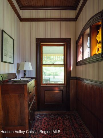 a kitchen with a stove a refrigerator and a window