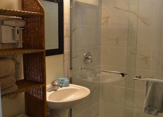 921 Center Street, Unit 12 Key West, FL 33040 - Photo 14 of 22 a bathroom with a sink shower and a mirror