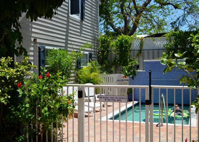 921 Center Street, Unit 12 Key West, FL 33040 - Photo 5 of 22 a view of a house with wooden fence