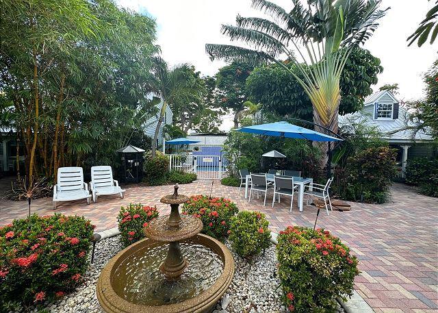 921 Center Street, Unit 12 Key West, FL 33040 - Photo 7 of 22 a view of a backyard with sitting area and furniture