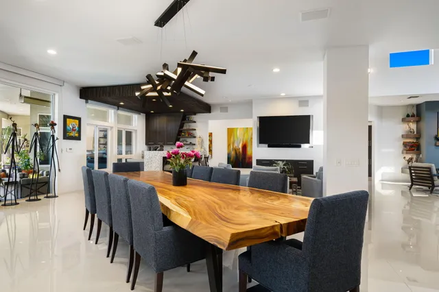 a kitchen with stainless steel appliances kitchen island granite countertop a sink and cabinets