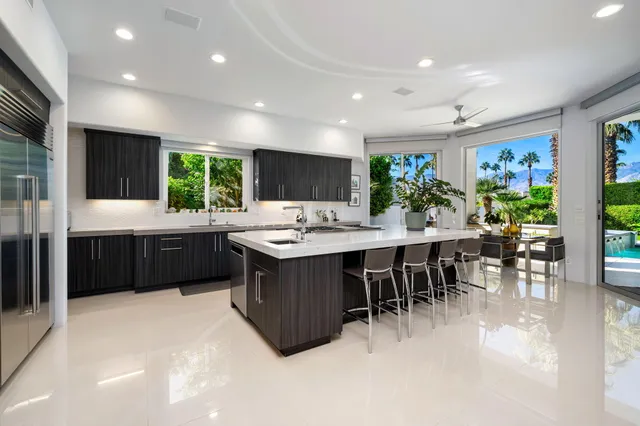 a view of an house with swimming pool garden and patio