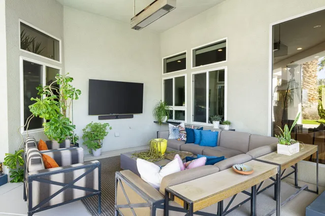 a bathroom with a sink a vanity and painting on the wall