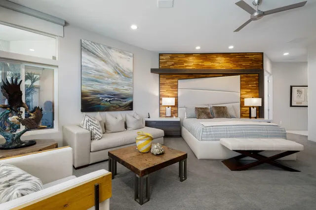 an aerial view of a house with swimming pool garden and outdoor seating